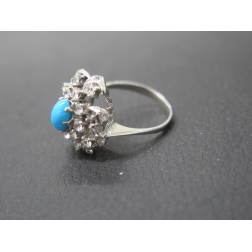 150 - A 14ct white gold (unmarked but tested) ring with turquoise white sapphire - ring size R - weight ap... 