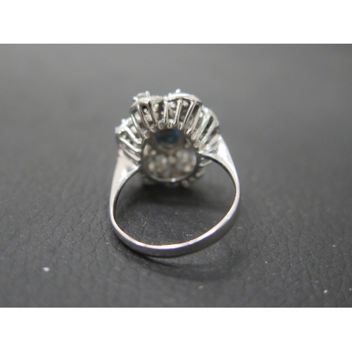 150 - A 14ct white gold (unmarked but tested) ring with turquoise white sapphire - ring size R - weight ap... 