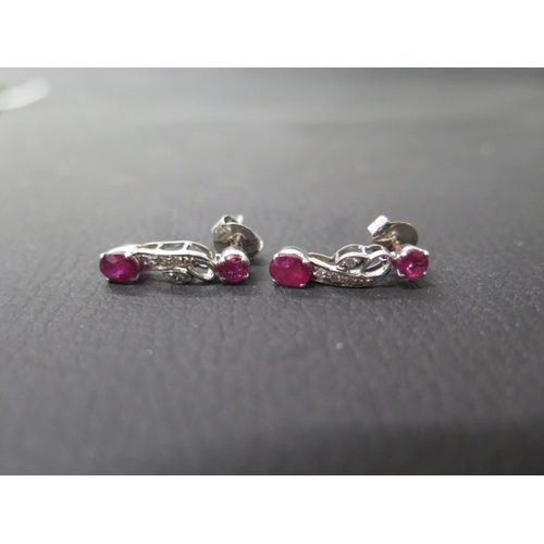 158 - A pair of 18ct white gold and ruby drop earrings with diamonds - approx 2cm - weight approx 3.2 gram... 