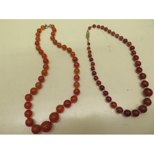 160 - Two cornelian graduated bead necklaces, 48cm and 42cm with assorted costume jewellery