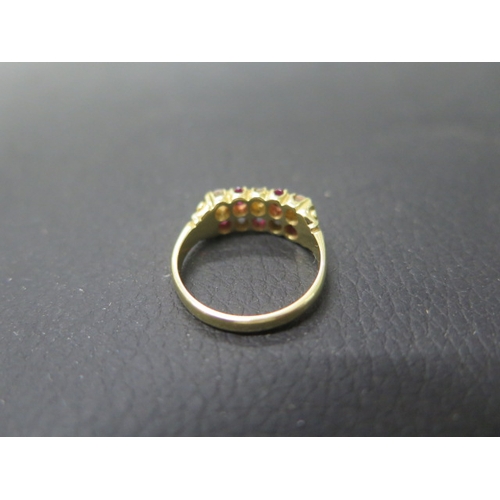 163 - An 18ct yellow gold diamond and ruby double row ring size O - weight approx 5.3 grams