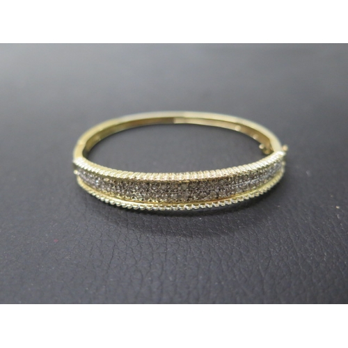 165 - A 14ct yellow gold bracelet with diamonds set in two rows - approx 6cm width - weight approx 16.3 gr... 