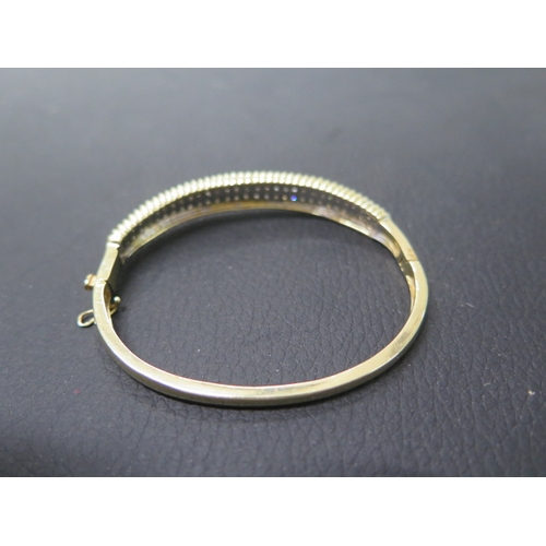 165 - A 14ct yellow gold bracelet with diamonds set in two rows - approx 6cm width - weight approx 16.3 gr... 