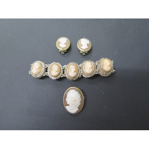 166 - A suite of silver cameo jewellery - bracelet, earrings and brooch