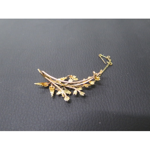 175 - A 14ct yellow gold pearl and diamond brooch, the central flower shape set with old cut diamond and p... 