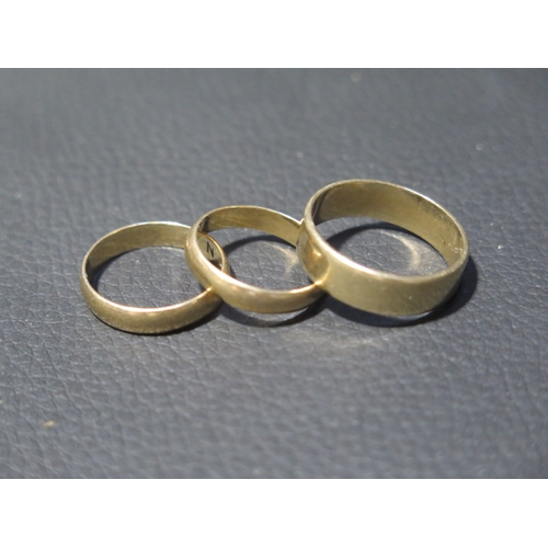 198 - Three 9ct yellow gold wedding bands sizes R/S, M & L - total weight approx 7.9 grams