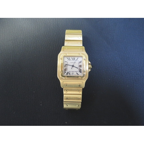 A Cartier 18ct yellow gold unisex Santos date quartz bracelet wristwatch no 887901 0878 - 29mm case - with two extra links and pouch - total weight approx 120 grams - in generally good condition, in running order - cost new over £30,000