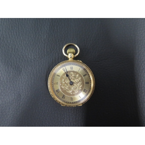 253 - An 18ct yellow gold cased fob watch, finely engraved case - approx 33mm