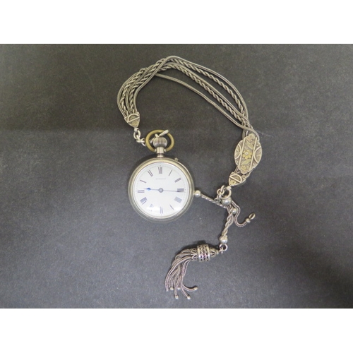 254 - A Russells silver cased fob watch approx 4cm - together with a good silver watch chain