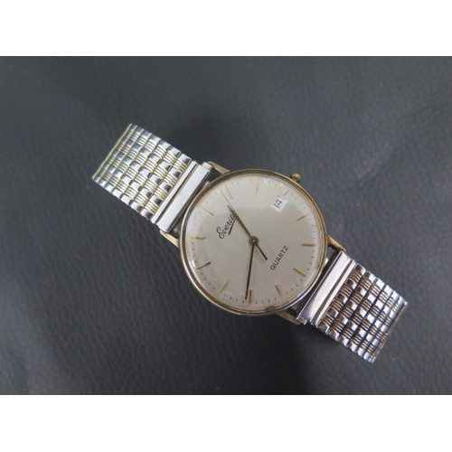 257 - A gents 9ct yellow gold case Everite quartz wristwatch with metal bracelet strap