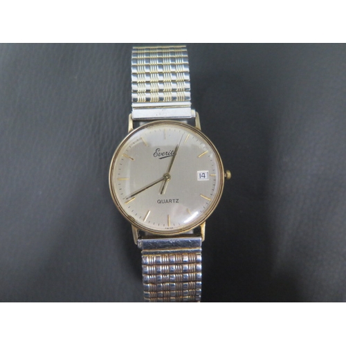 257 - A gents 9ct yellow gold case Everite quartz wristwatch with metal bracelet strap