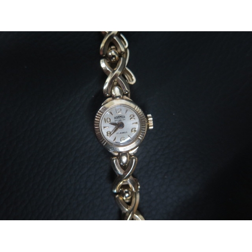 258 - A 9ct yellow gold lady's Roamer wristwatch - 9ct gold case approx 16mm - with 9ct gold bracelet stra... 