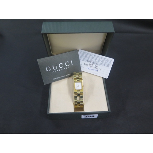 259 - A ladies gold coloured Gucci quartz wristwatch, rectangular case approx 17mm x 29mm with box, origin... 