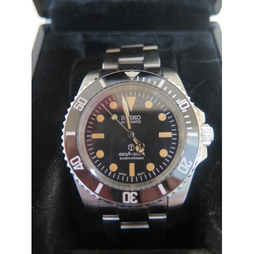 263 - A gents Seiko automatic submariner steel cased and bracelet wristwatch with a black dial and bezel -... 