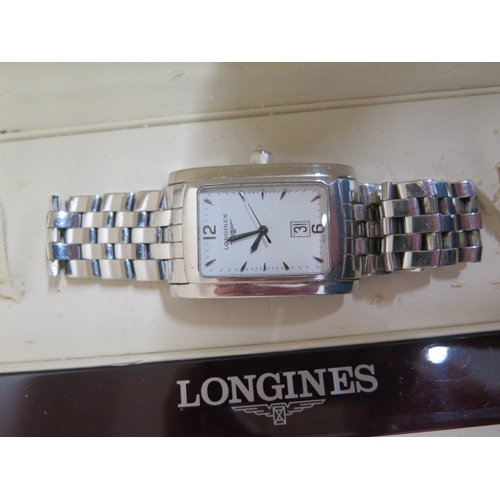 275 - A gents Longines watch in its original box and in working order