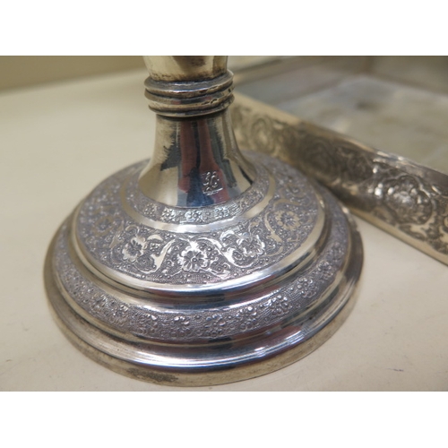 314 - A Middle Eastern silver candlestick - approx 20cm - weight approx 6.3 troy oz - together with a Midd... 