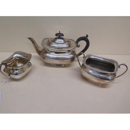 320 - A three piece silver tea set - Teapot approx 26cm x 15cm, sugar bowl and milk jug Sheffield 1927 - t... 