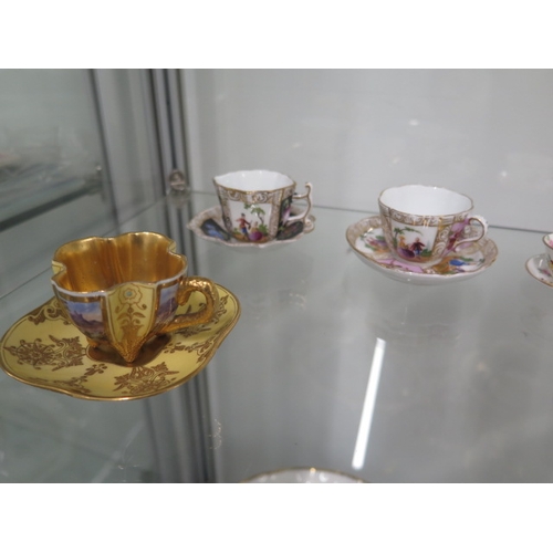 395 - A nice collection of miniature cups and saucers