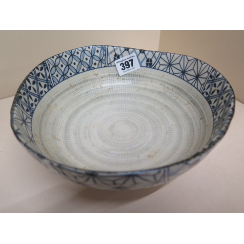 397 - A Japanese/Chinese blue and white bowl of irregular size