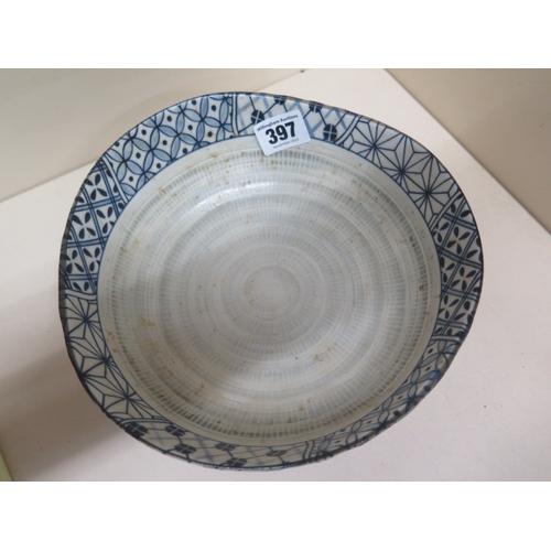 397 - A Japanese/Chinese blue and white bowl of irregular size