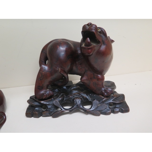 401 - A Chinese carved wood figure of Tiger approx 19cm on matching carved wood stand together with a carv... 