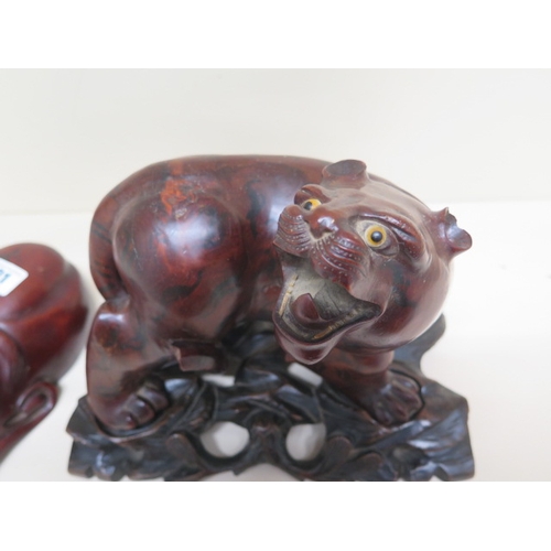 401 - A Chinese carved wood figure of Tiger approx 19cm on matching carved wood stand together with a carv... 