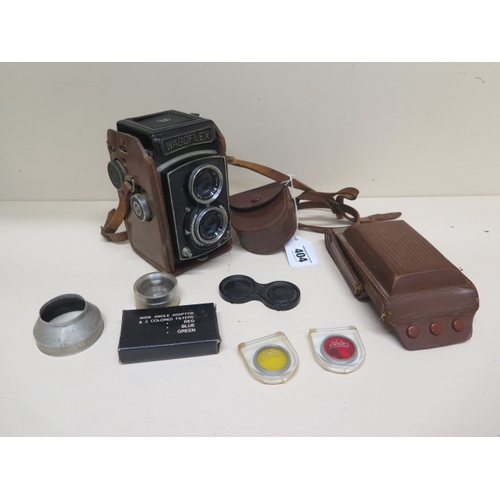 404 - A Walz Wagoflex camera with matching fitted brown leather case and accessories