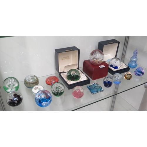 414 - A collection of 17 assorted paperweights