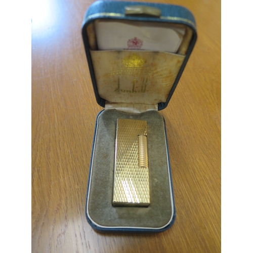 418 - A Dupont lighter boxed, a Dunhill and six others