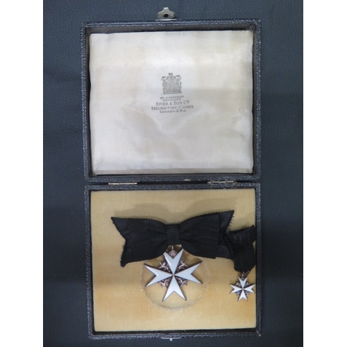 425 - An Order of St John medal with miniature in Spink & Son Ltd London box