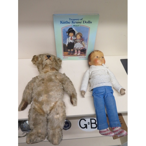 451 - A Kathe Kruse doll and book and a vintage teddy bear