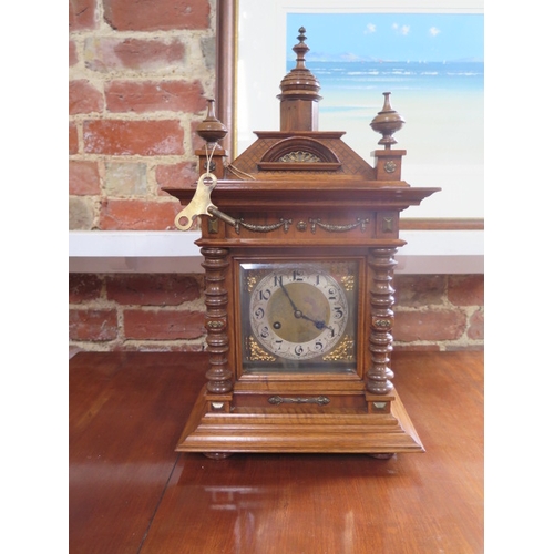 492 - A walnut 8 day striking bracket clock with a metal dial - approx 55cm x 30cm - working with key