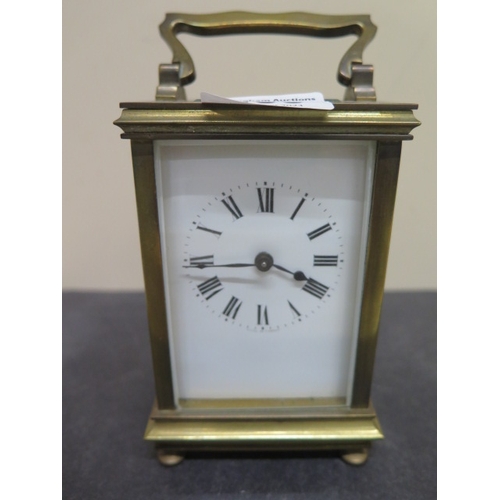 495 - A brass cased carriage clock - Height approx 12cm - seen working