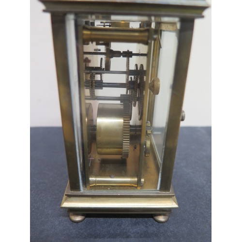 495 - A brass cased carriage clock - Height approx 12cm - seen working