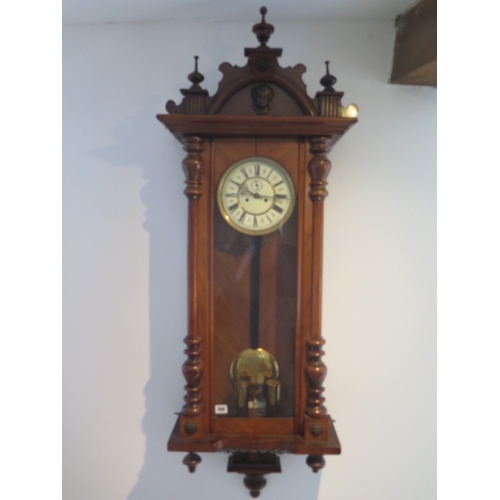 499 - An 8 day double weight Vienna wall clock in a mahogany case