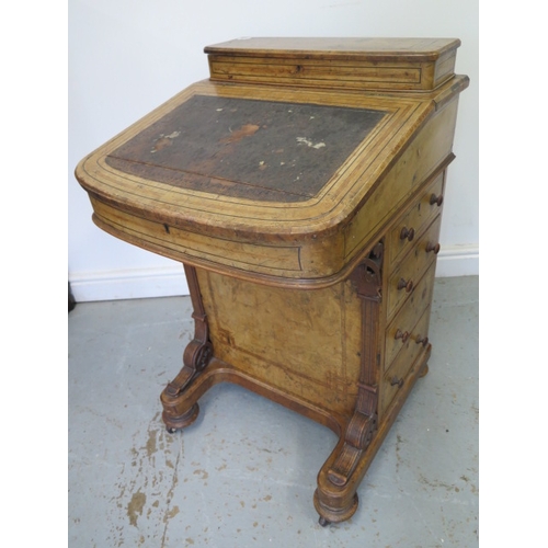 504 - A 19th century walnut and inlaid Davenport with a fitted interior and four drawers