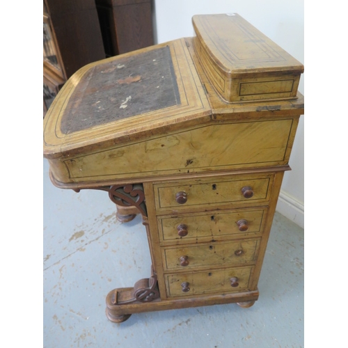 504 - A 19th century walnut and inlaid Davenport with a fitted interior and four drawers