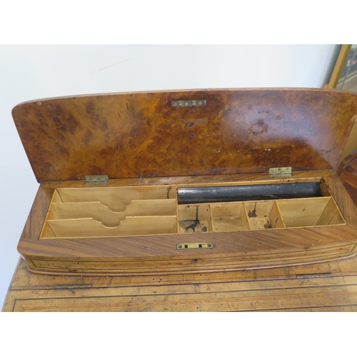 504 - A 19th century walnut and inlaid Davenport with a fitted interior and four drawers