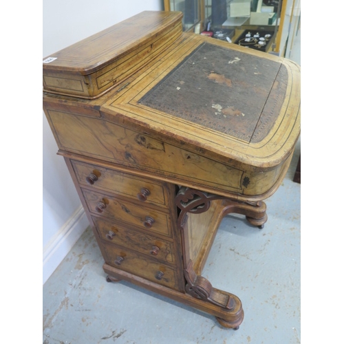 504 - A 19th century walnut and inlaid Davenport with a fitted interior and four drawers