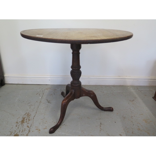 506 - A 19th century mahogany tripod table with a 78cm diameter top