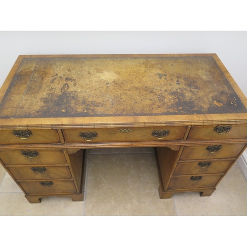 509 - A good quality late 19th century walnut nine drawer knee hole desk with a leather inset top - Width ... 