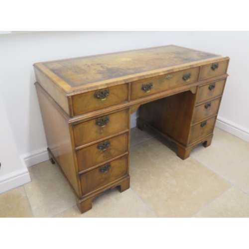 509 - A good quality late 19th century walnut nine drawer knee hole desk with a leather inset top - Width ... 