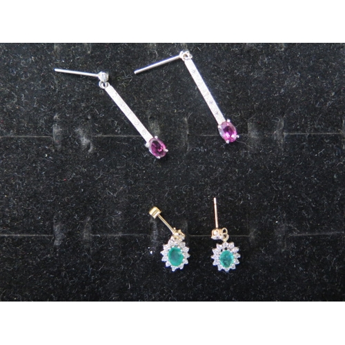 55 - Two pairs of 9ct gold earrings with ruby and emerald - weight approx 3.7 grams - 9ct white gold drop... 