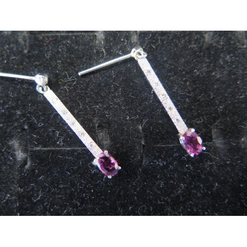 55 - Two pairs of 9ct gold earrings with ruby and emerald - weight approx 3.7 grams - 9ct white gold drop... 