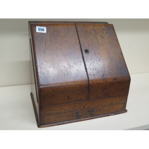 556 - An oak writing box with internal calendar etc - approx 30cm x 29cm x 22cm