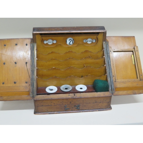 556 - An oak writing box with internal calendar etc - approx 30cm x 29cm x 22cm