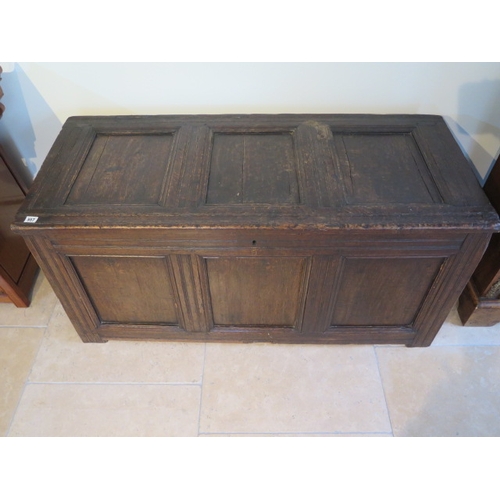 557 - An early 18th century oak coffer with field panel decoration - 61cm x 126cm x 55cm - good dark brown... 