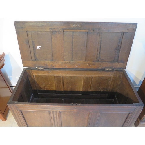 557 - An early 18th century oak coffer with field panel decoration - 61cm x 126cm x 55cm - good dark brown... 