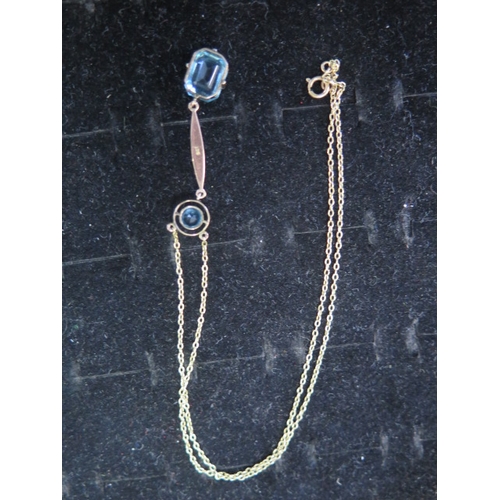 56 - An Art Nouveau style 9ct gold pendant and chain - The 9ct rose gold pendant with blue stones approx ... 