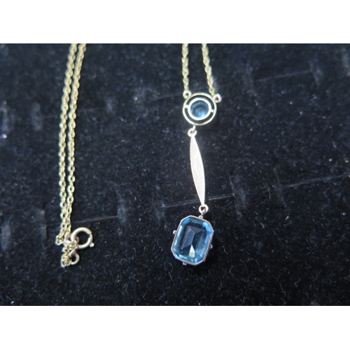 56 - An Art Nouveau style 9ct gold pendant and chain - The 9ct rose gold pendant with blue stones approx ... 